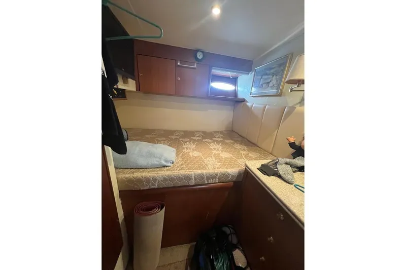 Slide: The Image of Interior of 1999 Ocean Yachts 48 Express with cozy bed. - 45