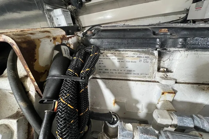 Slide: The Image of Engine compartment of a 1999 Ocean Yachts 48 Express with technical details. - 46