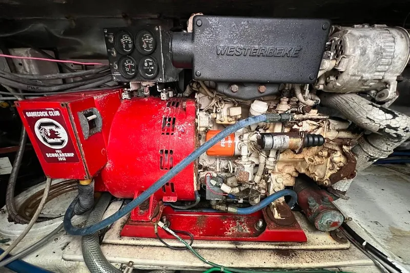 Slide: The Image of Engine compartment of a 1999 Ocean Yachts 48 Express with Westerbeke generator. - 48