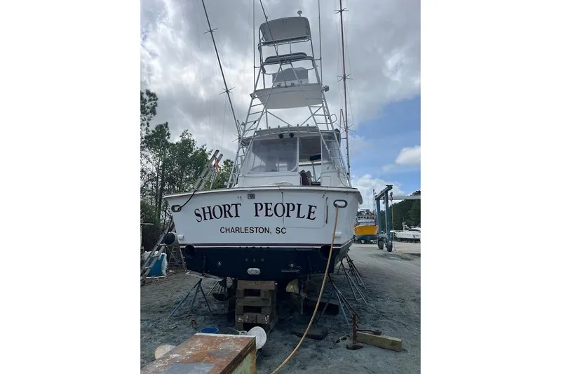 Slide: The Image of 1999 Ocean Yachts 48 Express boat named "Short People" in Charleston, SC, on dry dock. - 63
