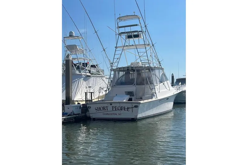 Slide: The Image of 1999 Ocean Yachts 48 Express docked in Charleston, SC marina. - 64