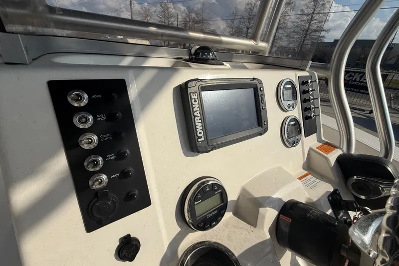 Slide: The Image of 2018 Robalo R200 Center Console dashboard with Lowrance display and control panel. - 15