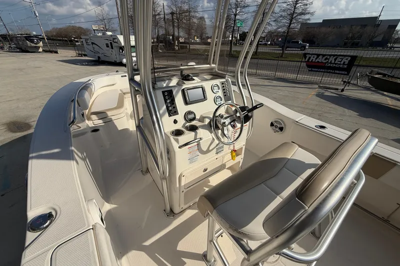 Slide: The Image of 2018 Robalo R200 Center Console boat with modern helm and seating. - 8