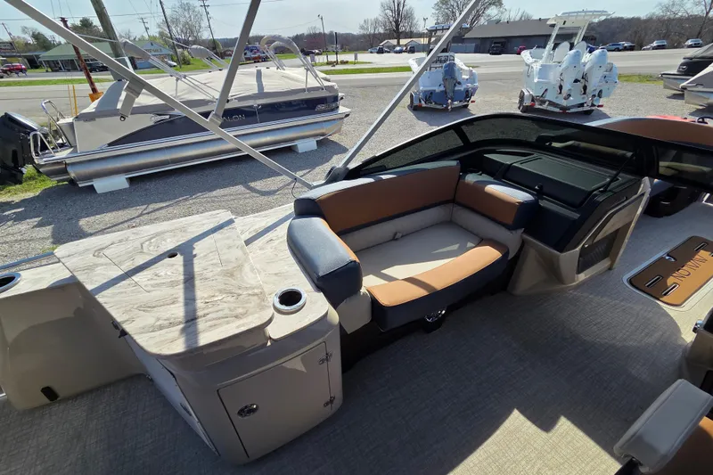 Slide: The Image of Interior of 2026 Avalon Platinum Catalina 2585 Windshield Elite pontoon boat, featuring luxurious seating. - 11