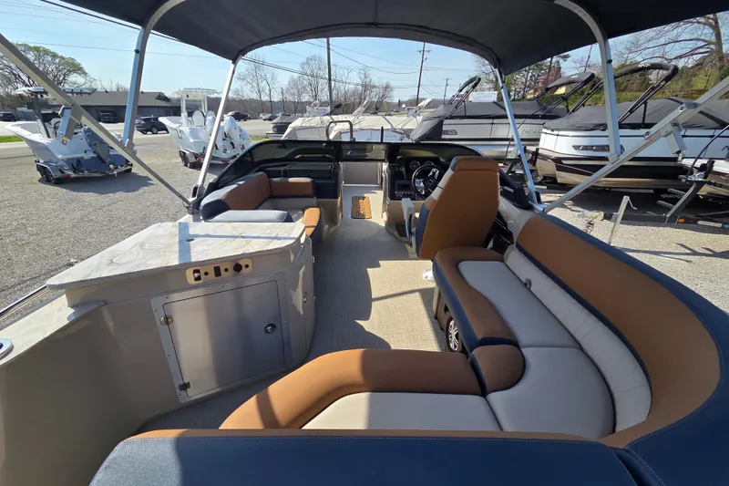 Slide: The Image of 2026 Avalon Platinum Catalina 2585 Windshield Elite interior with seating and helm, under canopy. - 12