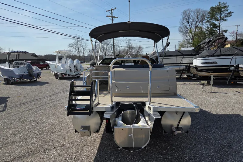 Slide: The Image of 2026 Avalon Platinum Catalina 2585 Windshield Elite pontoon boat, rear view in a dealership lot. - 5