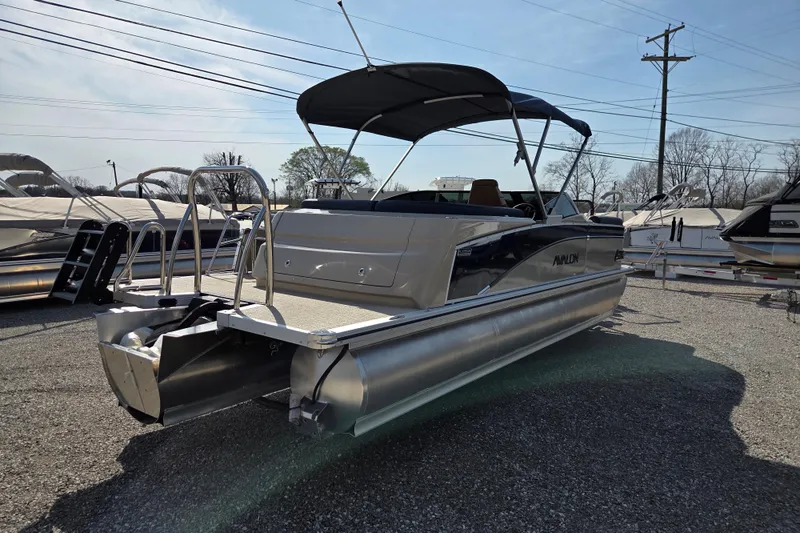 Slide: The Image of 2026 Avalon Platinum Catalina 2585 Windshield Elite pontoon boat with canopy, parked outdoors. - 6