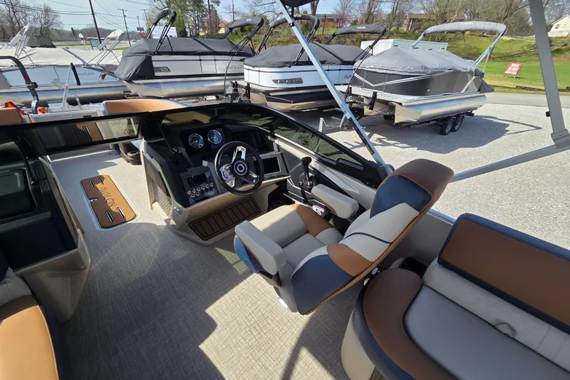 Slide: The Image of Interior view of 2026 Avalon Platinum Catalina 2585 Windshield Elite boat with luxurious seating. - 9
