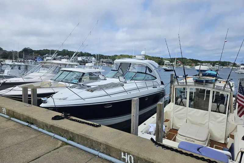 The Image of 2010 Formula 34 Performance Cruiser docked at a marina with other boats. - 0