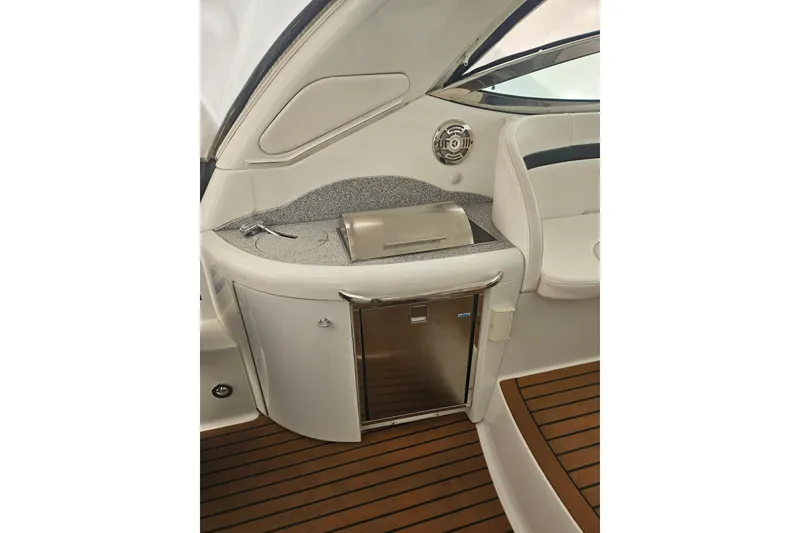 Slide: The Image of 2010 Formula 34 Performance Cruiser interior with kitchenette and seating area. - 11