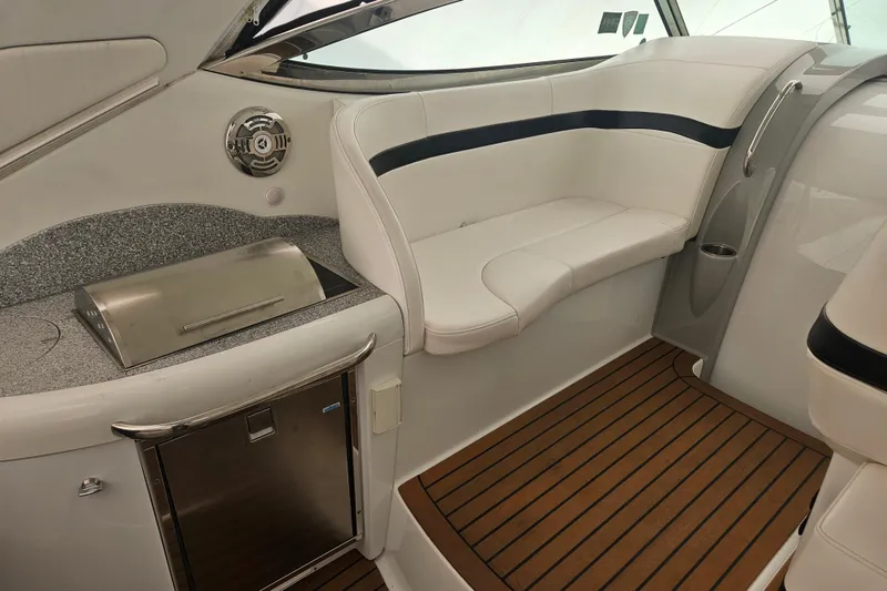 Slide: The Image of 2010 Formula 34 Performance Cruiser interior with seating, grill, and wood flooring. - 12