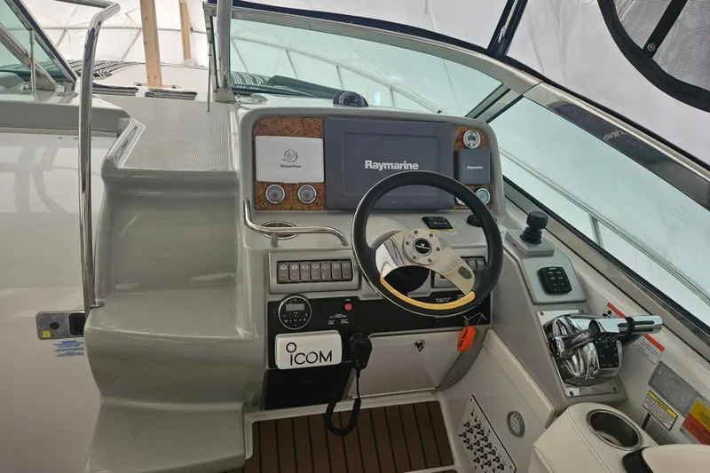 Slide: The Image of 2010 Formula 34 Performance Cruiser helm with Raymarine navigation system and ICOM communication equipment. - 13