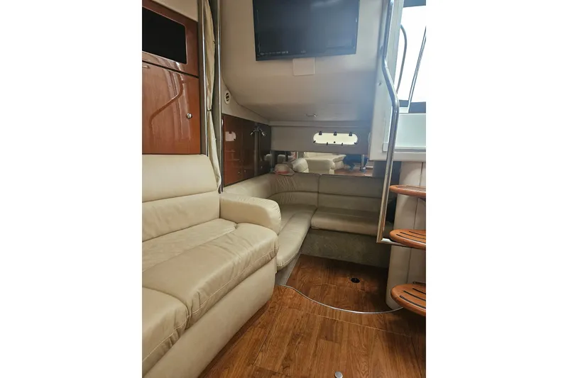 Slide: The Image of Interior of 2010 Formula 34 Performance Cruiser with beige seating and wooden flooring. - 15