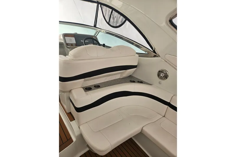 Slide: The Image of 2010 Formula 34 Performance Cruiser interior with white seating and sleek design. - 18