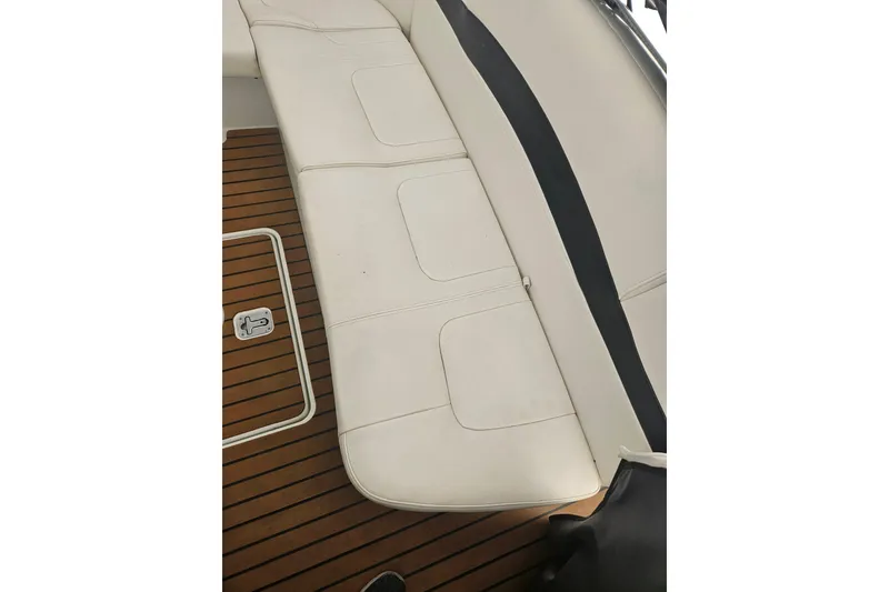 Slide: The Image of 2010 Formula 34 Performance Cruiser interior with white seating and teak flooring. - 21