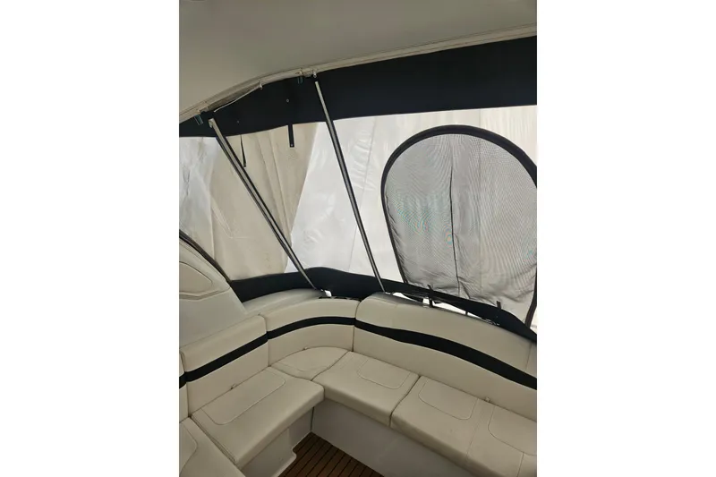 Slide: The Image of 2010 Formula 34 Performance Cruiser interior with white seating and black accents. - 22