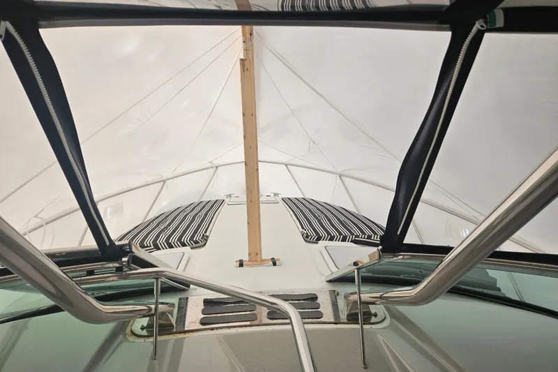 Slide: The Image of 2010 Formula 34 Performance Cruiser under protective cover, showcasing deck and railings. - 25