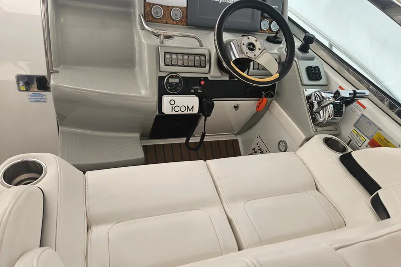 Slide: The Image of 2010 Formula 34 Performance Cruiser helm with steering wheel and control panel. - 28