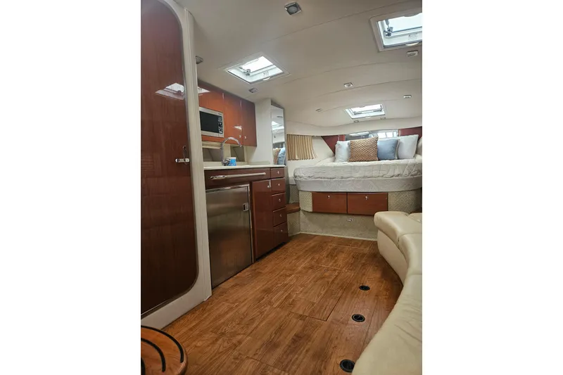 Slide: The Image of Interior of 2010 Formula 34 Performance Cruiser with wood flooring and cozy sleeping area. - 30