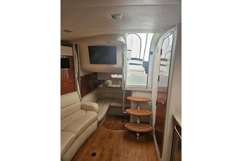 Slide: The Image of Interior of 2010 Formula 34 Performance Cruiser with beige seating and wooden flooring. - 36