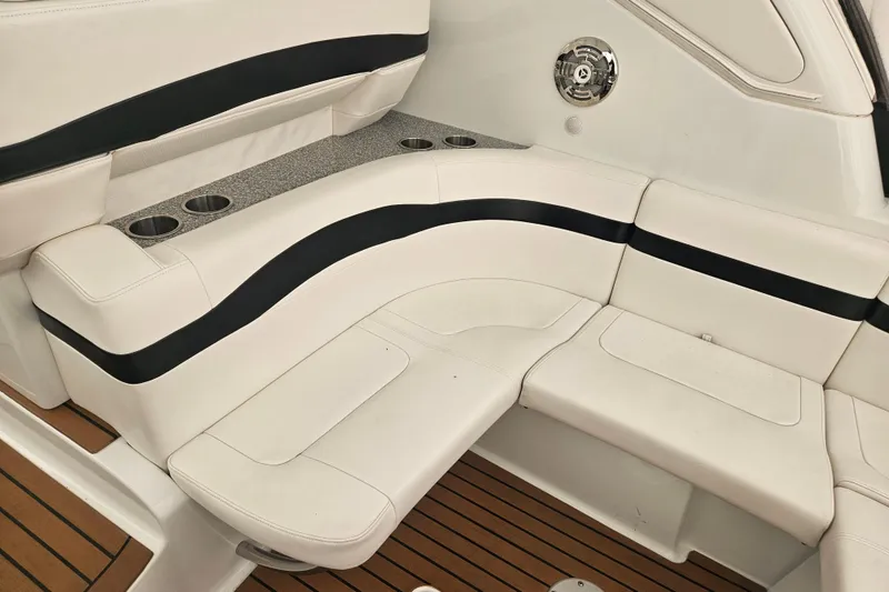 Slide: The Image of 2010 Formula 34 Performance Cruiser interior seating with cup holders and speaker. - 39