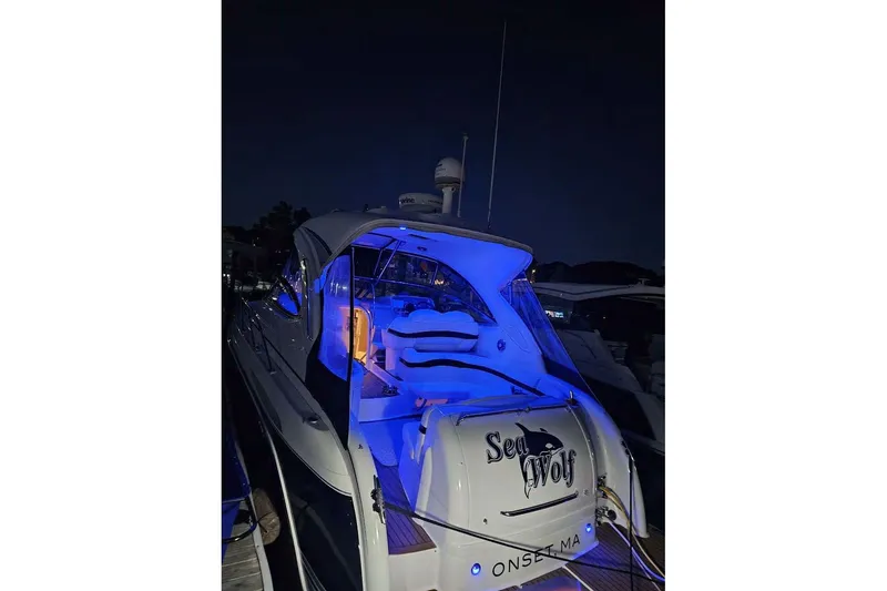 Slide: The Image of 2010 Formula 34 Performance Cruiser with blue interior lighting at night. - 4