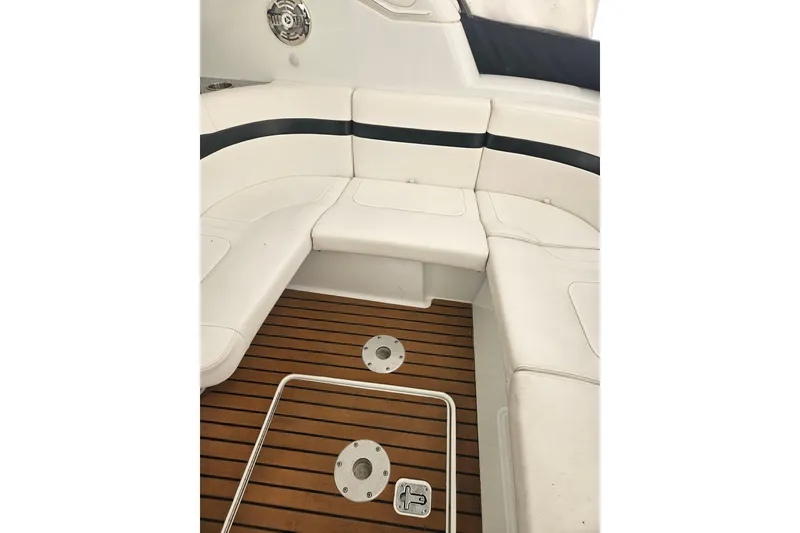 Slide: The Image of 2010 Formula 34 Performance Cruiser interior with white seating and teak flooring. - 40