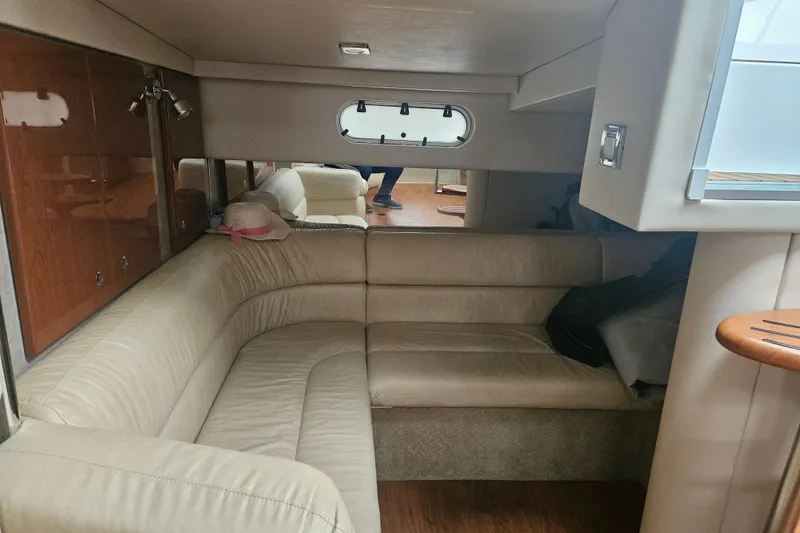 Slide: The Image of Interior of 2010 Formula 34 Performance Cruiser with beige seating and wooden accents. - 46