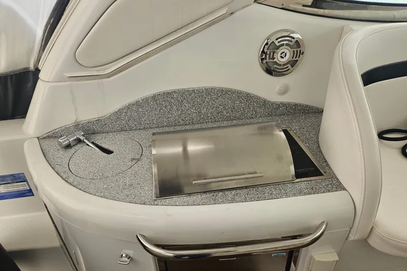 Slide: The Image of Interior of a 2010 Formula 34 Performance Cruiser with a sleek countertop and built-in grill. - 47