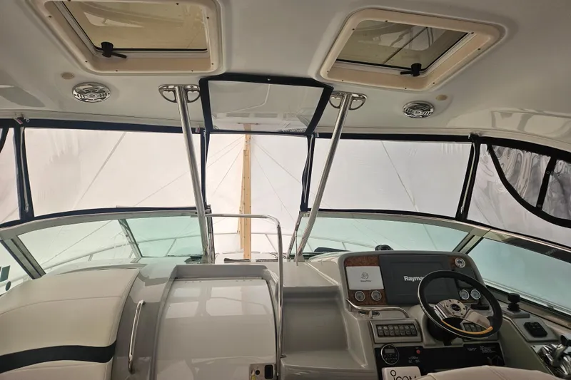 Slide: The Image of Interior view of 2010 Formula 34 Performance Cruiser cockpit with steering wheel and navigation equipment. - 49