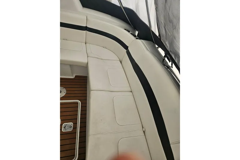 Slide: The Image of 2010 Formula 34 Performance Cruiser interior with white seating and wood flooring. - 53