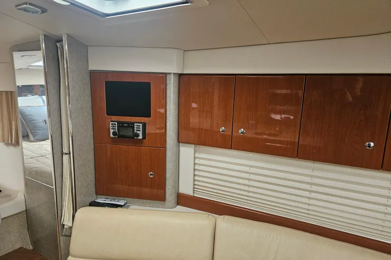 Slide: The Image of Interior of 2010 Formula 34 Performance Cruiser with wood cabinets and entertainment system. - 56