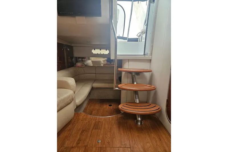 Slide: The Image of Interior of 2010 Formula 34 Performance Cruiser with wooden steps and beige seating. - 58