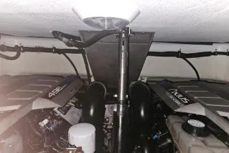 Slide: The Image of Engine compartment of a 2010 Formula 34 Performance Cruiser, showcasing dual engines and components. - 60