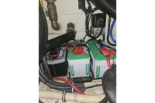 Slide: The Image of Batteries and wiring inside a 2010 Formula 34 Performance Cruiser engine compartment. - 61