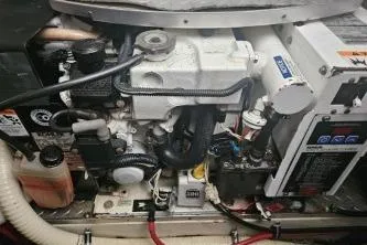 Slide: The Image of Engine compartment of a 2010 Formula 34 Performance Cruiser, showcasing mechanical components. - 64