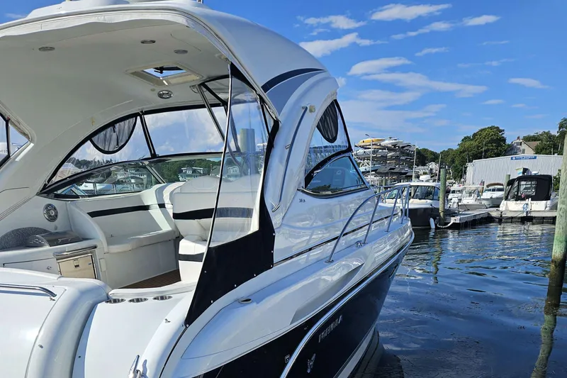 Slide: The Image of 2010 Formula 34 Performance Cruiser docked at marina under clear blue sky. - 9