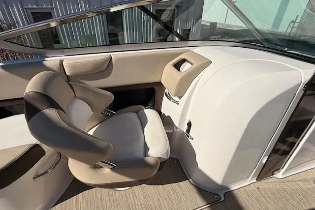 Slide: The Image of 2013 Regal 2500 Bowrider interior with beige seating and modern design. - 11