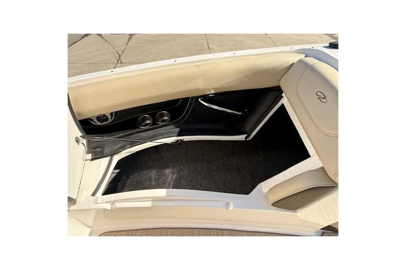 Slide: The Image of 2013 Regal 2500 Bowrider interior with beige seating and carpeted flooring. - 18