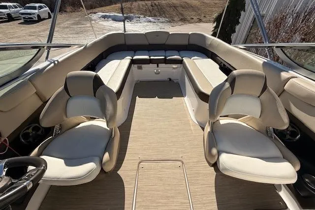 Slide: The Image of 2013 Regal 2500 Bowrider interior with beige seating and spacious layout. - 20