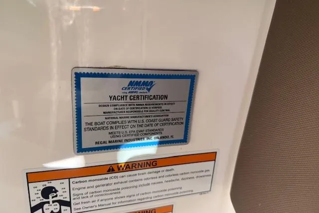 Slide: The Image of Yacht certification label on 2013 Regal 2500 Bowrider, highlighting safety compliance and warnings. - 26