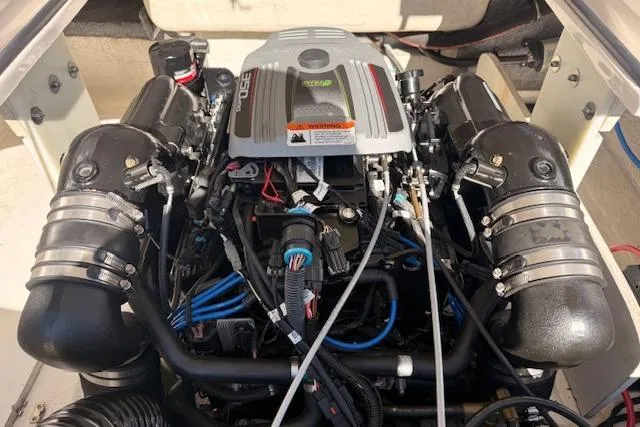 Slide: The Image of Engine of 2013 Regal 2500 Bowrider boat, showcasing detailed components and wiring. - 32