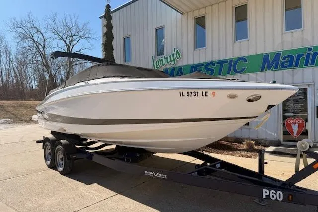 Slide: The Image of 2013 Regal 2500 Bowrider boat on trailer outside marine dealership. - 36