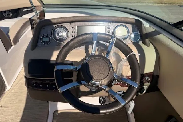 Slide: The Image of 2013 Regal 2500 Bowrider dashboard with steering wheel and instrument panel. - 6
