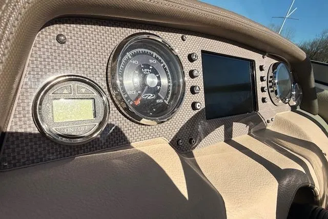 Slide: The Image of Dashboard of 2013 Regal 2500 Bowrider boat with speedometer and digital display. - 9