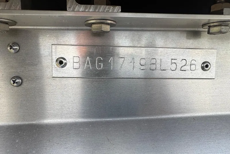 The Image of 2026 Bentley Pontoons Elite 253 Swingback Tritoon hull identification number plate. - 1