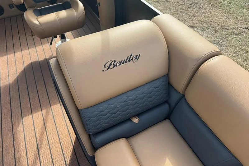 Slide: The Image of 2026 Bentley Pontoons Elite 253 Swingback Tritoon, luxurious tan and gray seating detail. - 13
