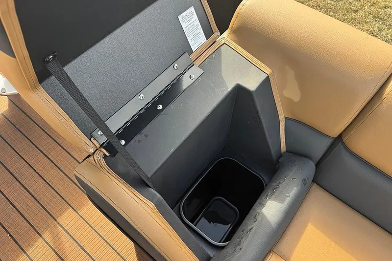 Slide: The Image of 2026 Bentley Pontoons Elite 253 Swingback seat storage compartment, open with visible interior. - 14