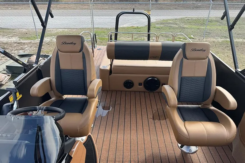 Slide: The Image of 2026 Bentley Pontoons Elite 253 interior with dual captain seats and luxury design. - 19