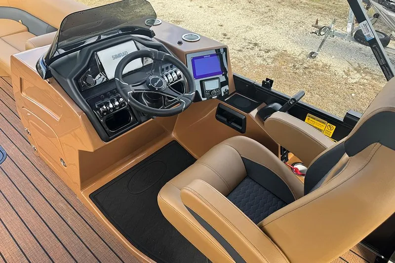 Slide: The Image of 2026 Bentley Pontoons Elite 253 Swingback Dual Captain Full Tritoon helm with modern controls and seating. - 20